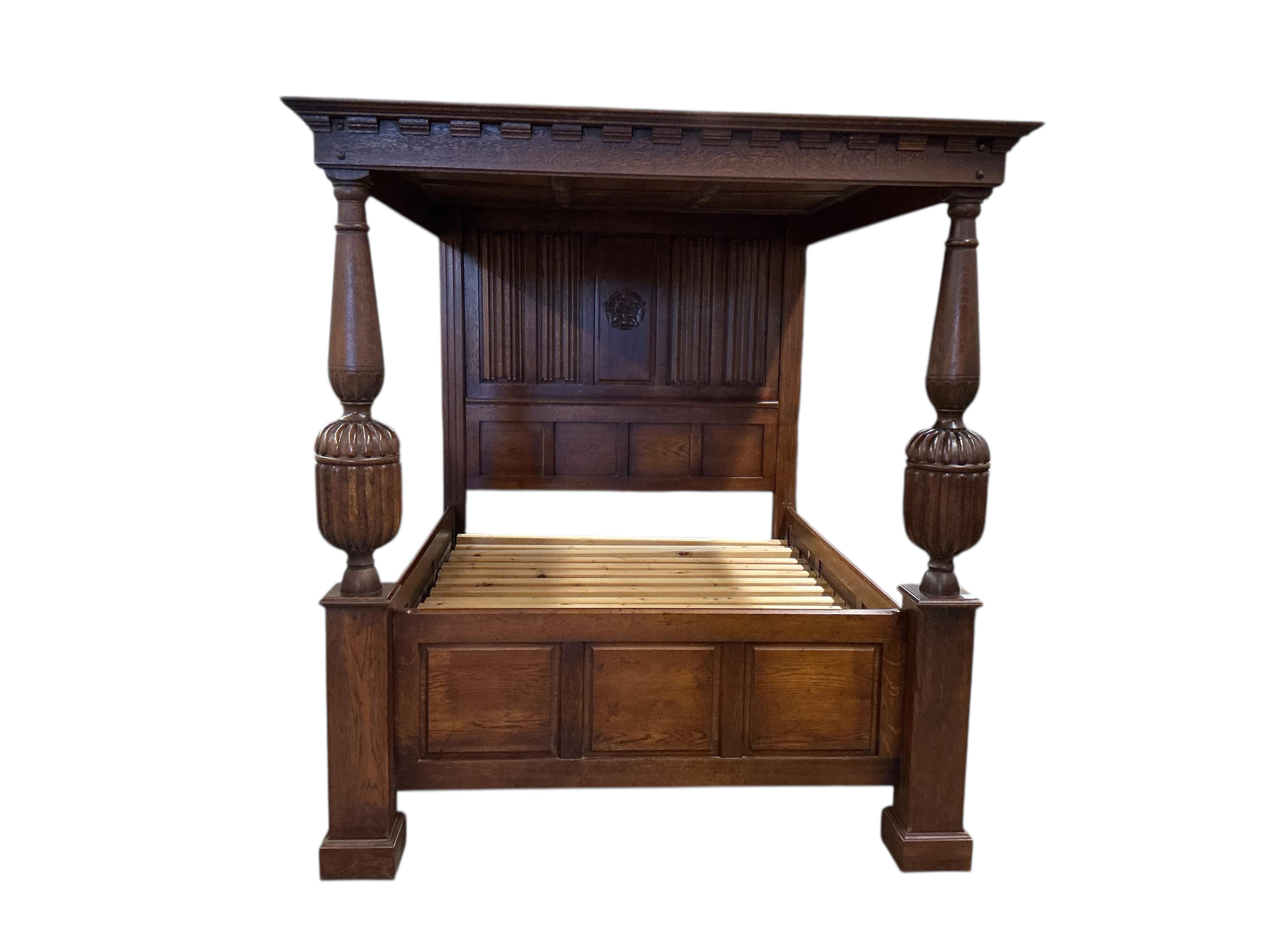 A reproduction Tudor style oak four poster bed, width 174cm, length 230cm, height 198cm